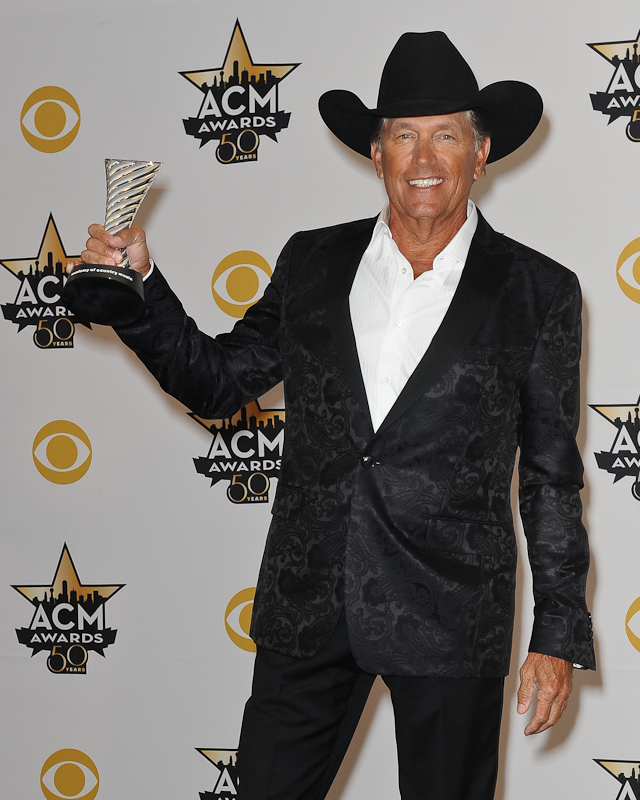 Honoree George Strait, recipient of the Milestone Award for ACM Winner Over Four Decades, poses in the press room at the 50th Academy Of Country Music Awards at AT&T Stadium on April 19, 2015 in Arlington, Texas. Photo © Manuel Nauta