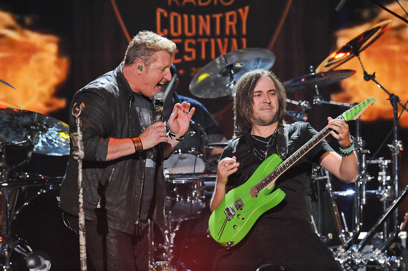 Singer Gary LeVox (L) of Rascal Flatts performs onstage during the 2015 iHeartRadio Country Festival at The Frank Erwin Center on May 2, 2015 in Austin, Texas. Photo © Manuel Nauta