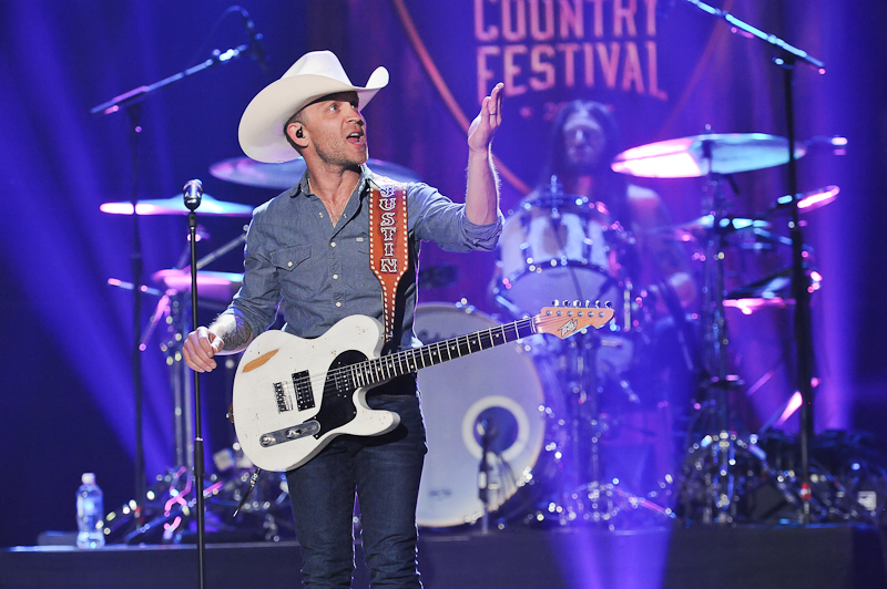 Recording artist Justin Moore performs onstage during the 2015 iHeartRadio Country Festival at The Frank Erwin Center on May 2, 2015 in Austin, Texas.  Photo © Manuel Nauta