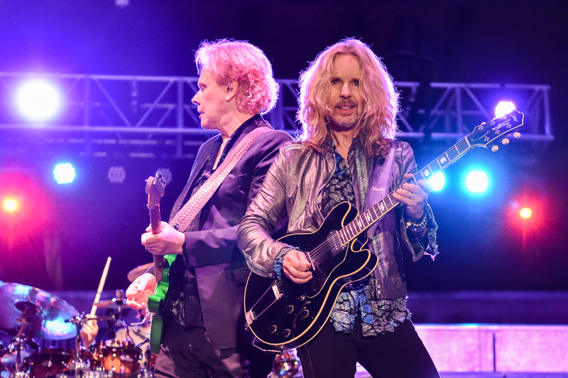 James Young (L) and Tommy Shaw (R) with the band Styx perform in concert at the Levitt Pavilion in Arlington, Texas on October 16, 2021